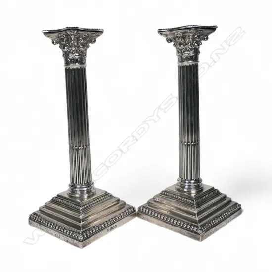 A pair of silver Corinthian column candlesticks with Richmond presentation engraving,