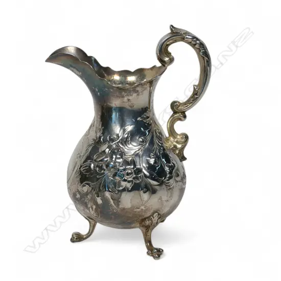 Early Victorian repousse silver cream jug,