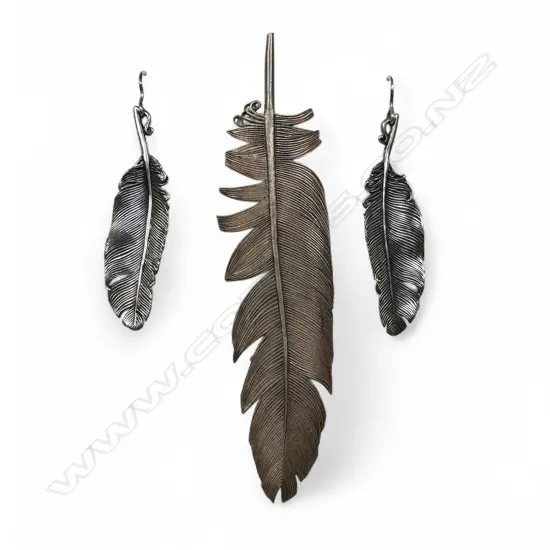 A contemporary artist made silver large feather brooch and similar earrings,