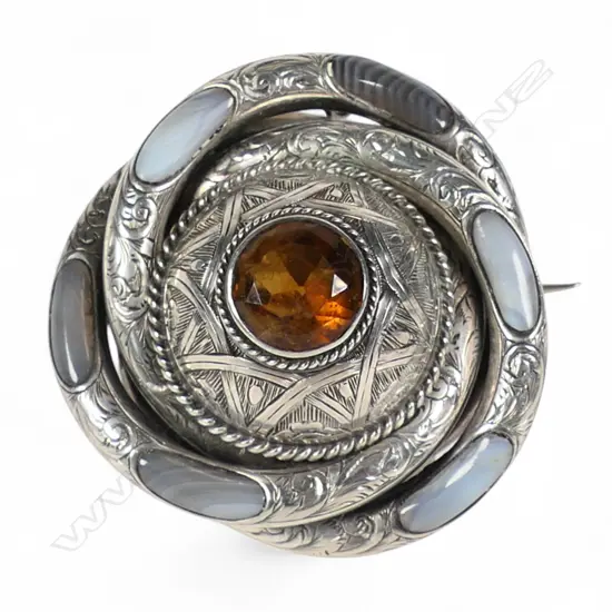 A late Victoria silver and large dome set pale agate and citrine brooch,