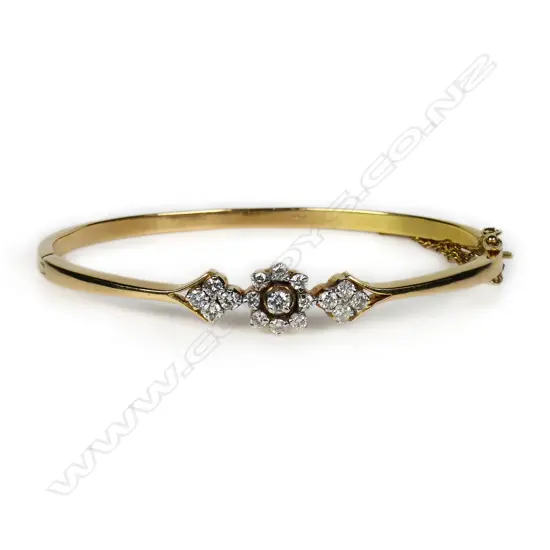 A 16ct gold and diamond hinged bangle,