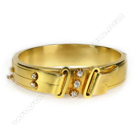An 18ct gold and diamond antique style hinged bangle,