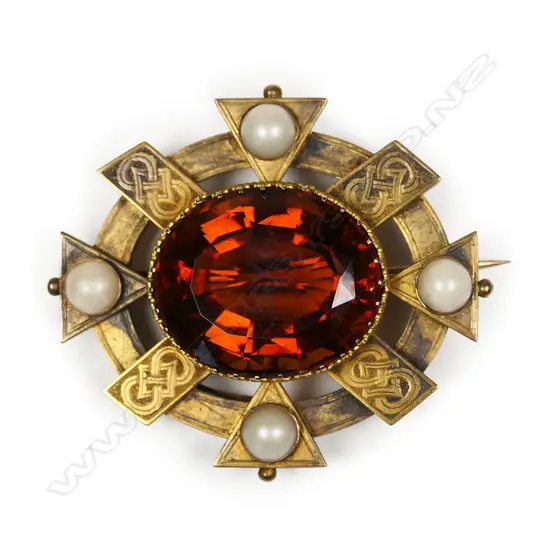 A late Victorian 9ct gold and gem set large designer brooch,