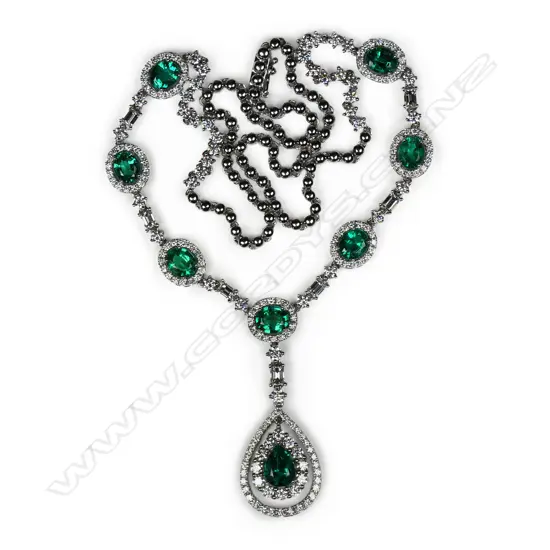 An impressive 14ct white gold emerald and diamond necklace,