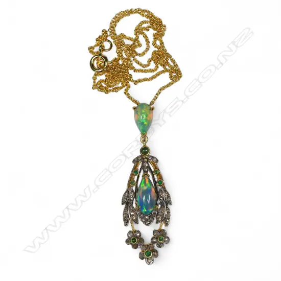 An antique style belle epoque silver gilt opal diamond and emerald pendant,