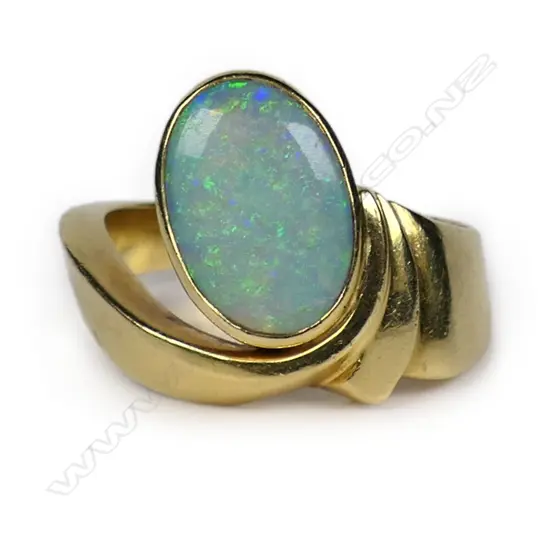 An 18ct gold and opal ring,