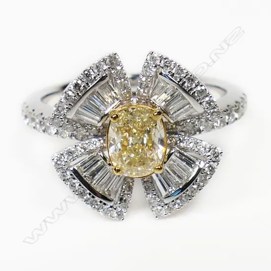 An 18ct white gold yellow and white diamond dress ring,