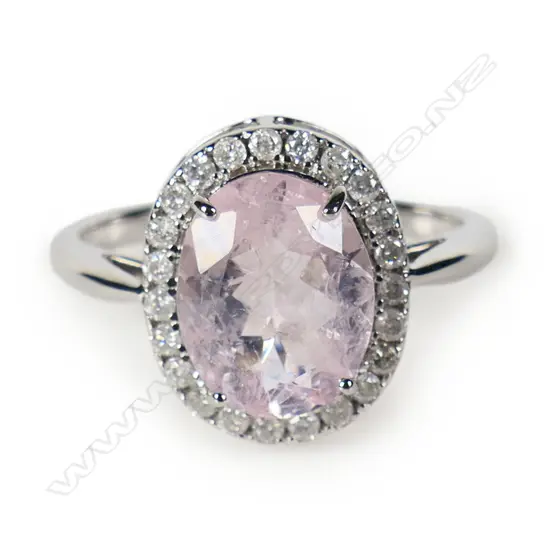 A 14ct white gold morganite and diamond halo ring,