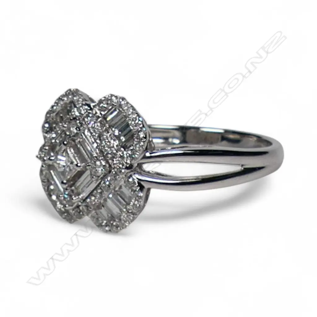 An 18ct white gold and diamond cluster ring, Image 1++
