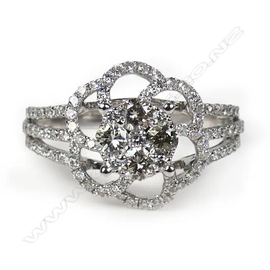 An 18ct white gold and diamond cluster ring,