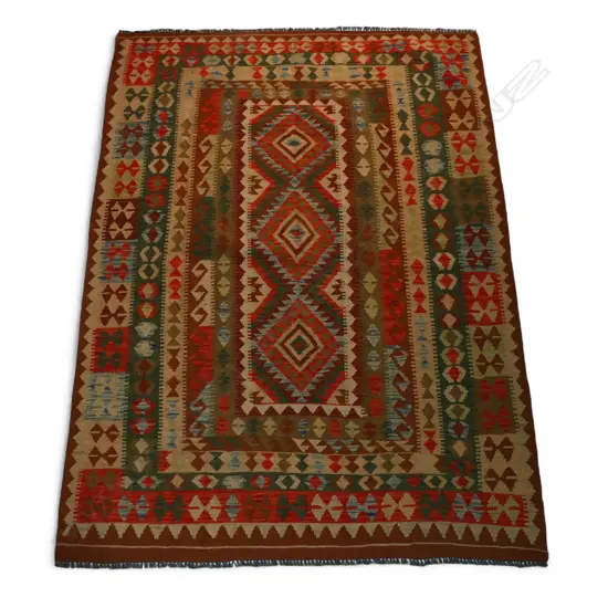 A hand woven kilim rug,