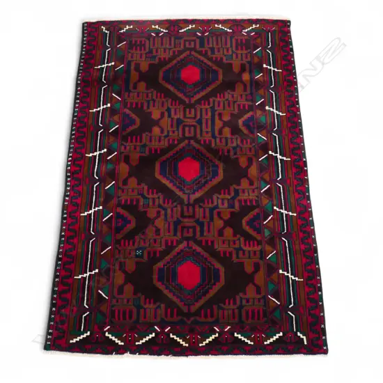 A hand knotted Baloch rug,