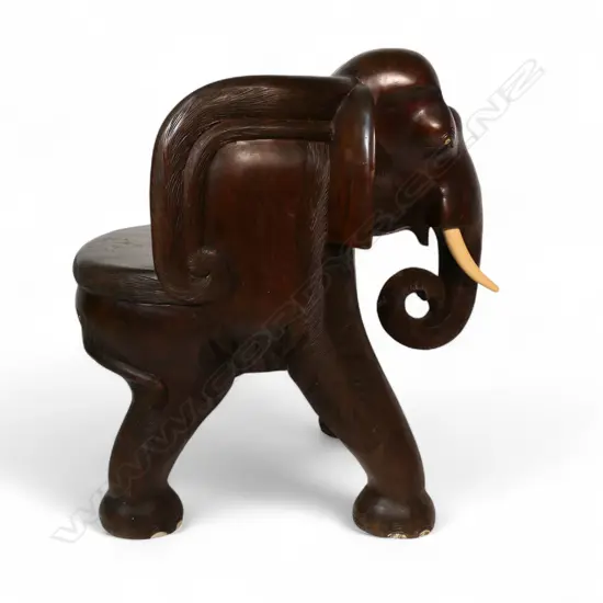 A large and impressive hardwood chair,