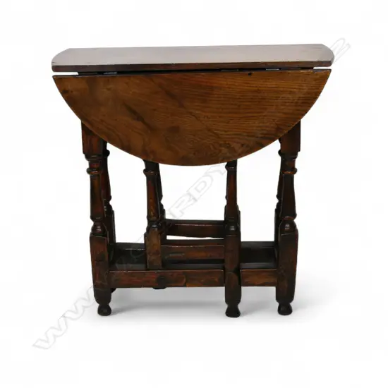A George III small proportion oak gate leg table,