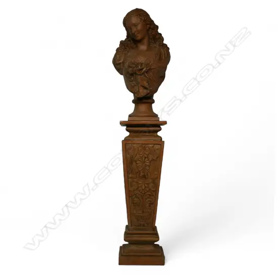 A terracotta bust of a classical woman,