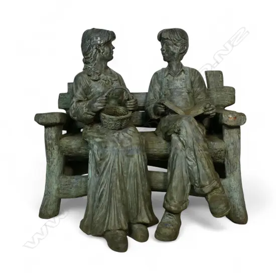 A very large and heavy cast bronze sculpture of a young farming couple seated upon a log bench,