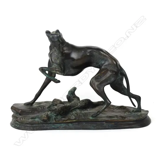 A 20thC bronze figure group of a dog with a hare