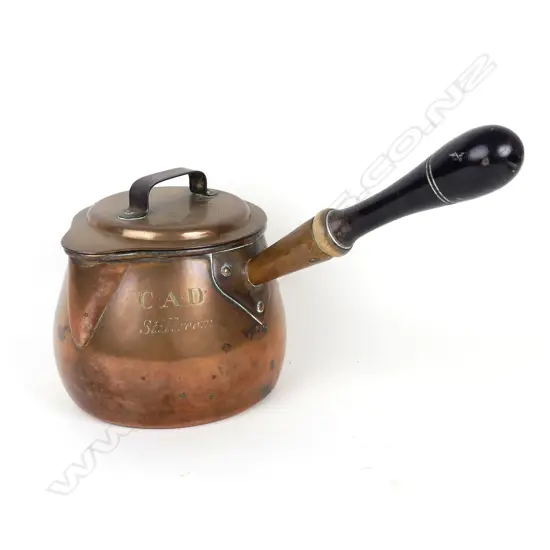 A large Victorian copper lidded brandy pan