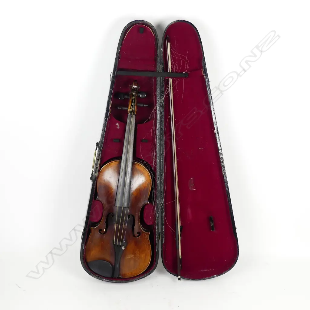 An antique violin and bow Image 1++