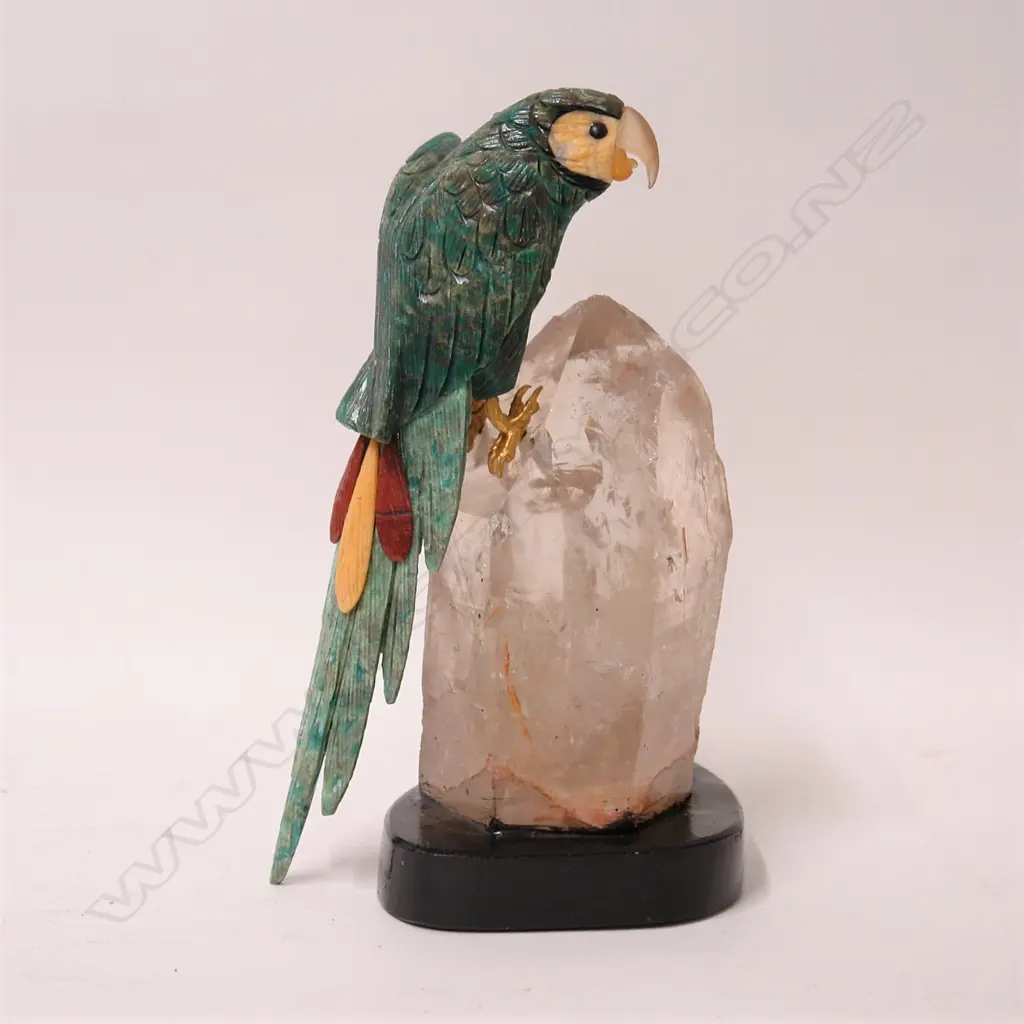 A carved amazonite parrot perched upon a single large clear rock crystal Image 1++