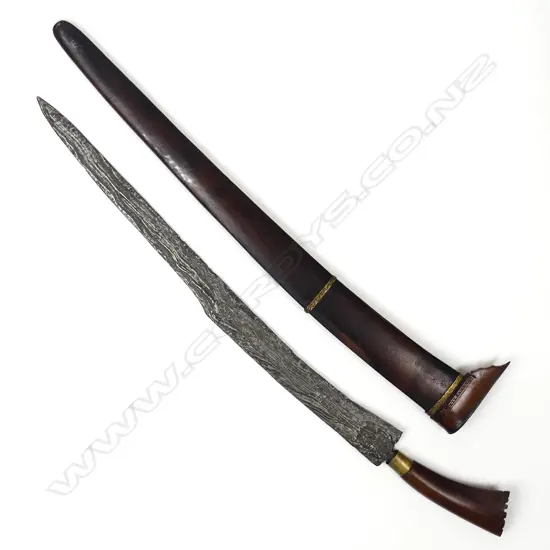 A Malay parang knife in scabbard
