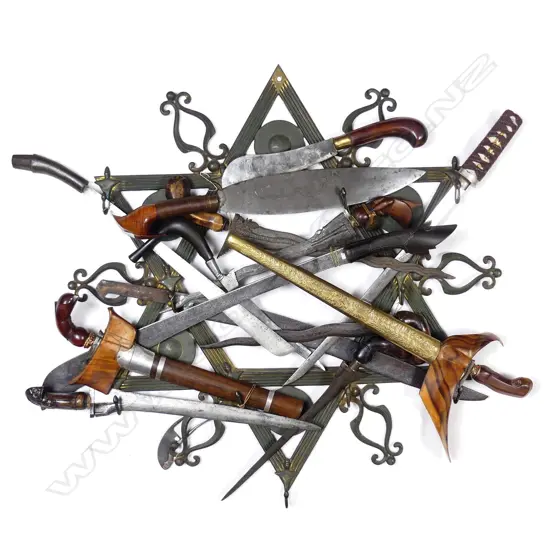 A display collection of fifteen Eastern and South East Asian bladed weapons