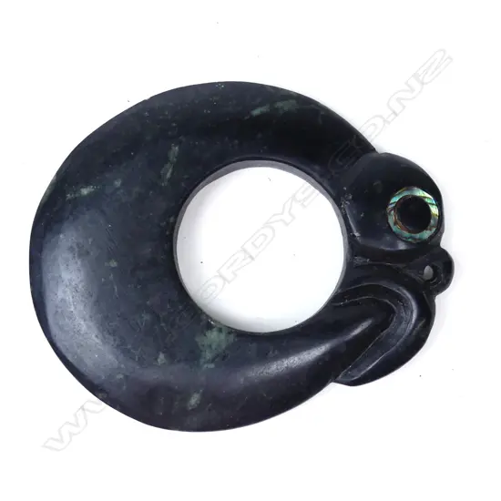 A Mike Higgs carved greenstone stylised Maori pendant