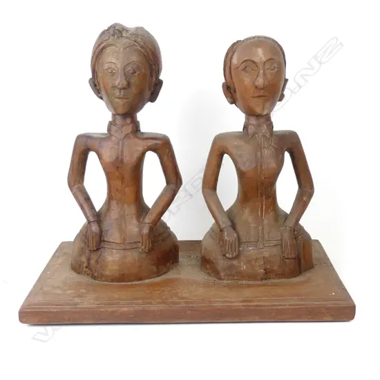 A pair of early 20thC Dutch East Indies naive European figures