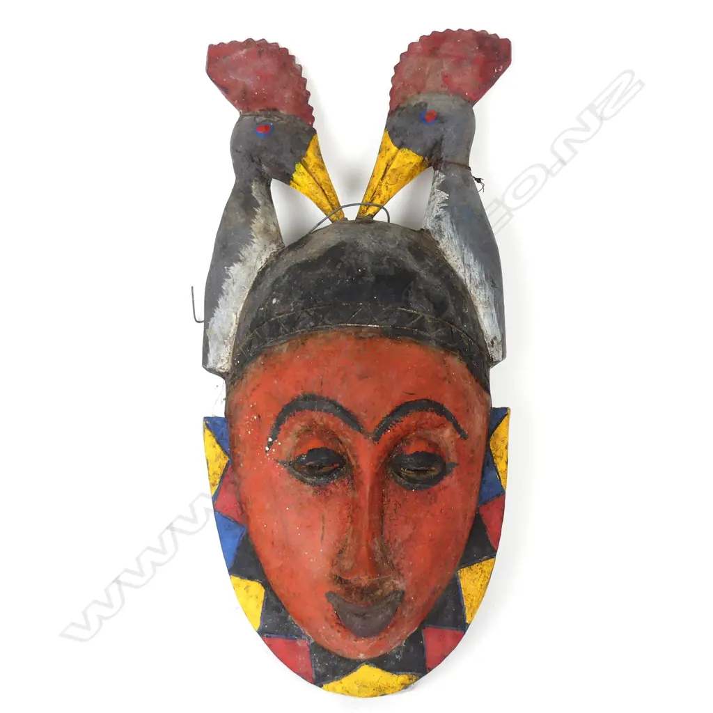An African carved wood mask Image 1++