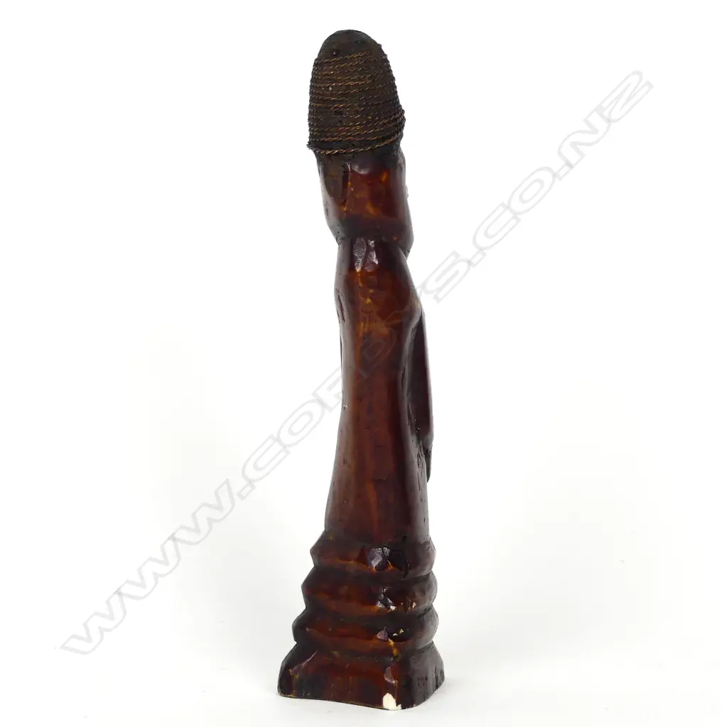 A dark stained carved bone shamanistic figure Image 1++