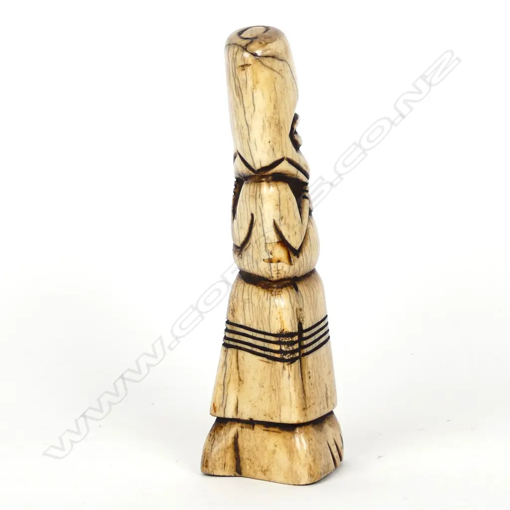 A carved bone shamanistic figure Image 1++