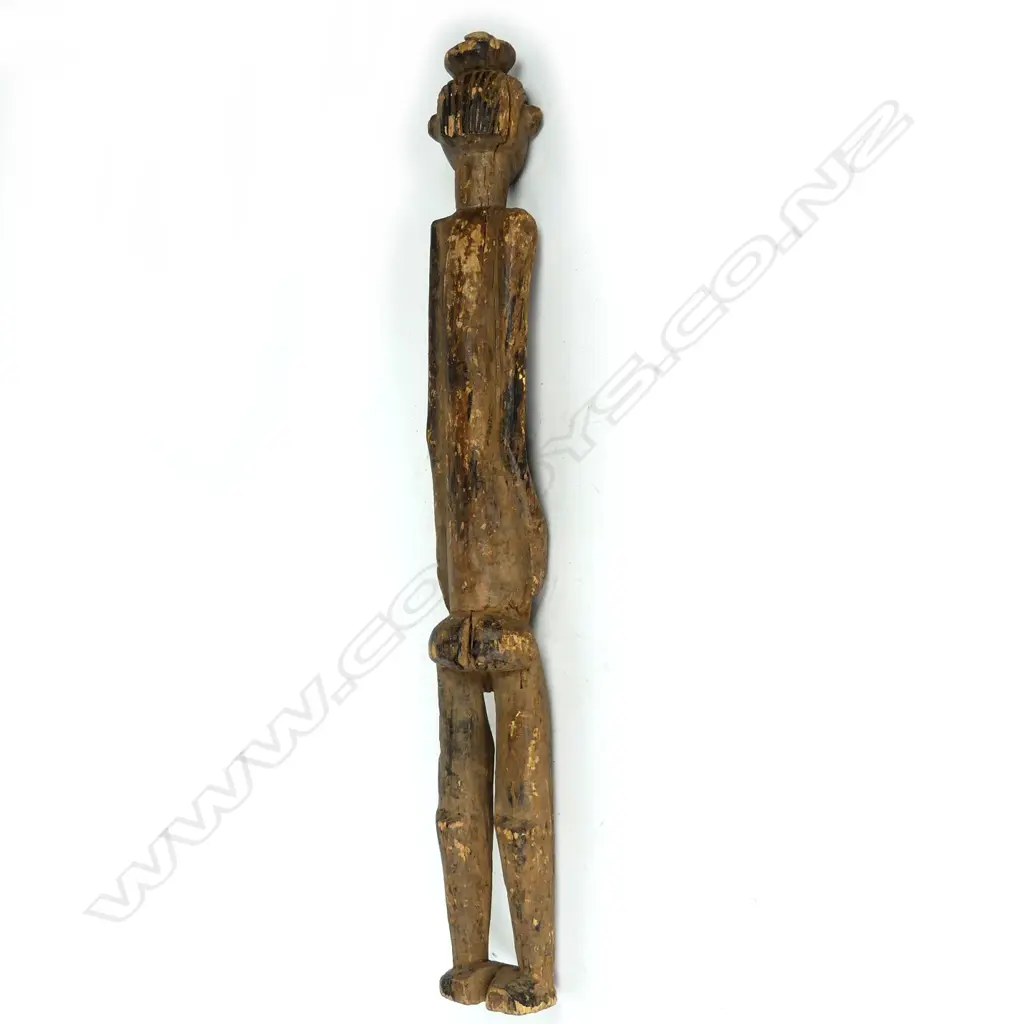 A tall African cast wooden female figure Image 1++