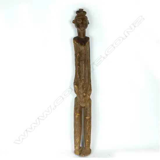 A tall African cast wooden female figure