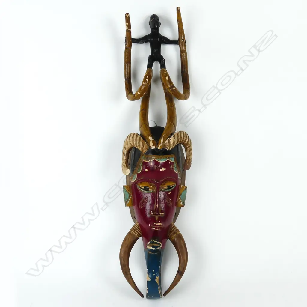 A Baule African tribal carved and painted mask Image 1++