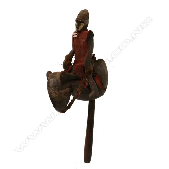 An African carved wood rider and animal