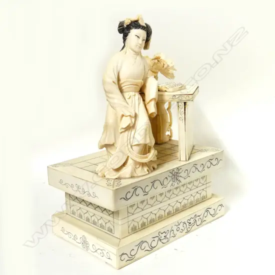 A Chinese carved ivory figure of a courtesan of the Qing court