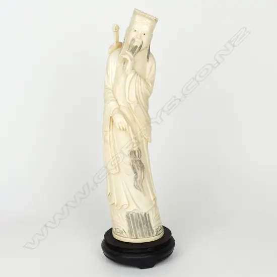 An old Chinese carved ivory figure of a sage