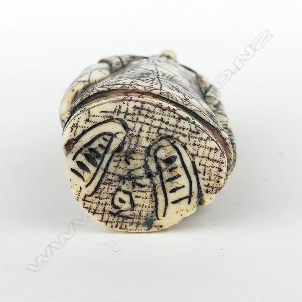 A Japanese carved bone netsuke of an old woman Image 1++