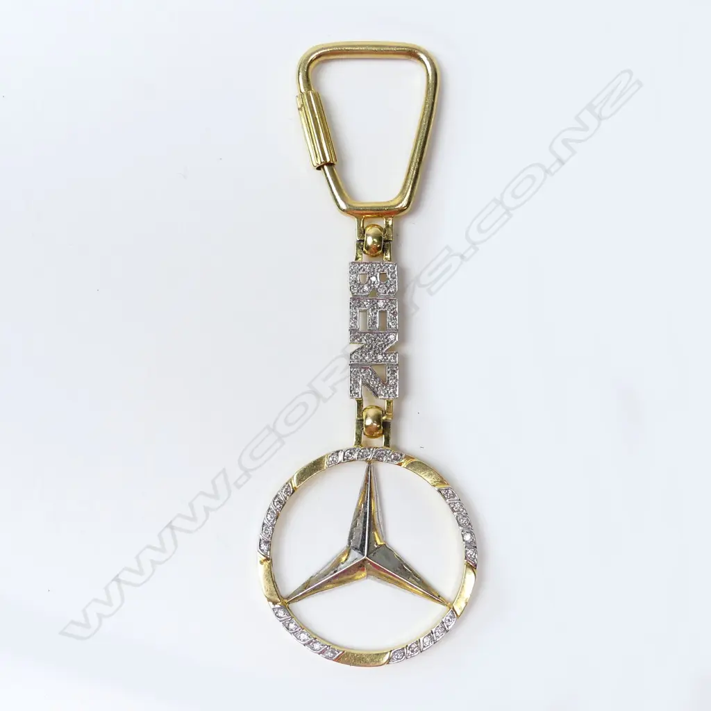 A diamond set 18ct gold Mercedes Benz key ring Image 1++
