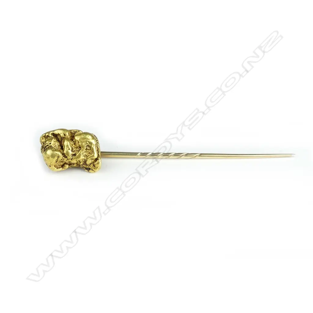 A gold stick pin Image 1++