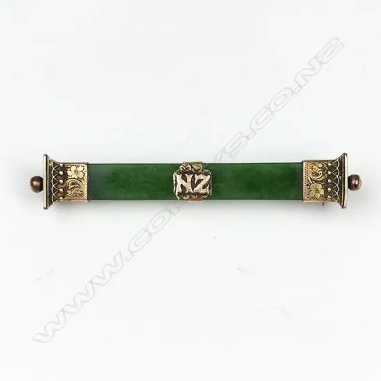 A NZ greenstone and 9ct gold bar brooch