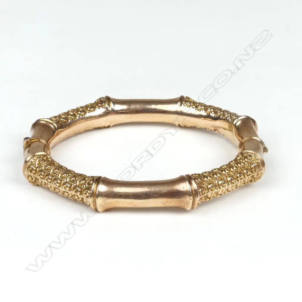 A 9ct rose gold half hinged bangle Image 1++