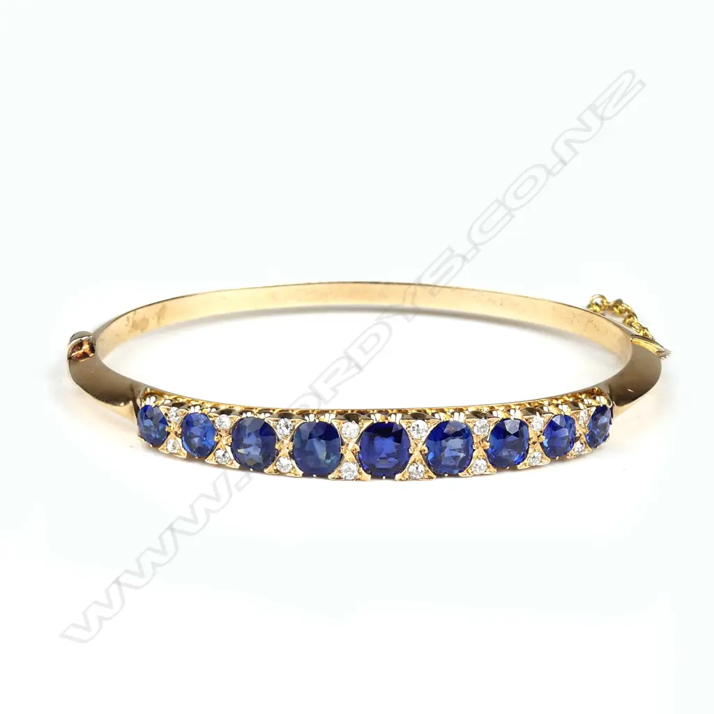 A Victorian 9ct rose gold sapphire and diamond hinged bangle Image 1++