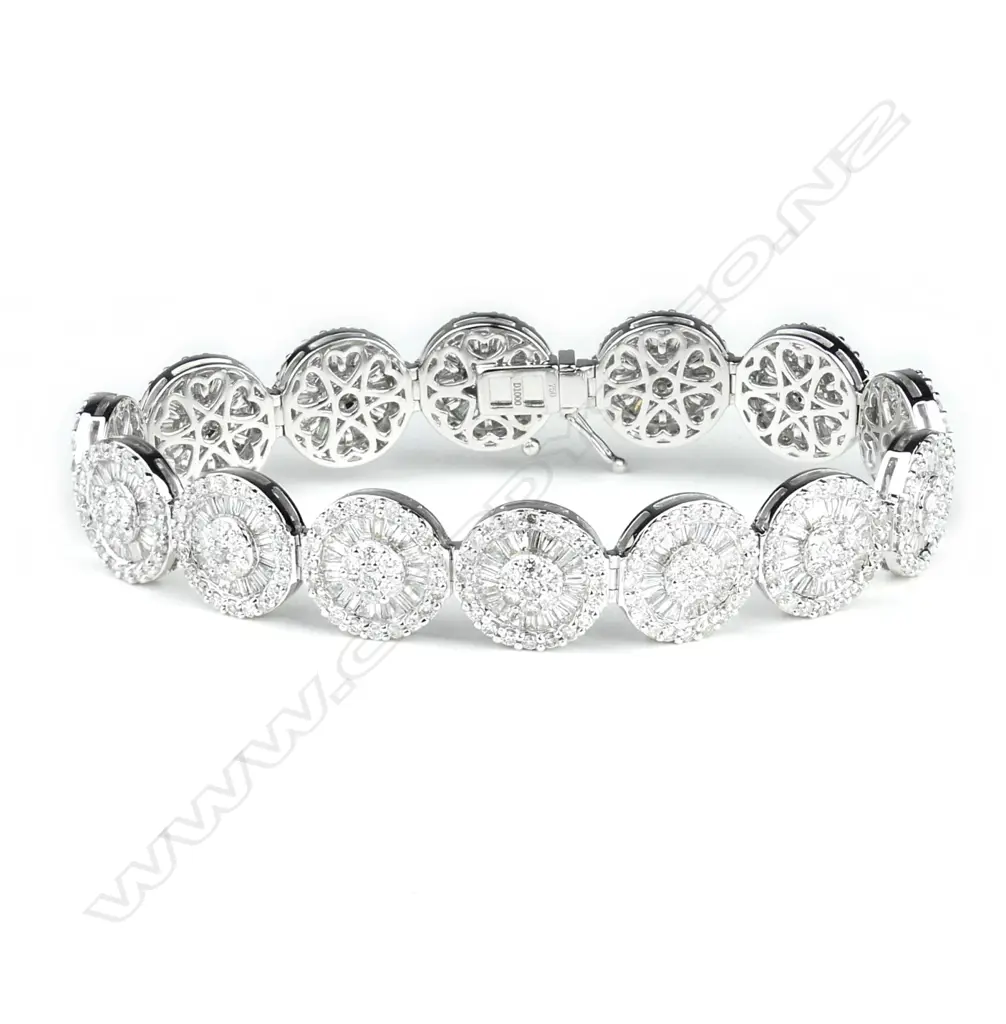An impressive modern 18ct. gold and multi-diamond set 14 cluster bracelet Image 1++