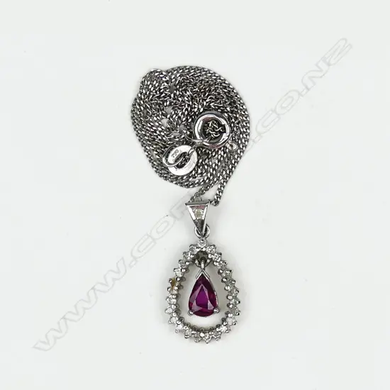 A 14ct white gold diamond and ruby pendant