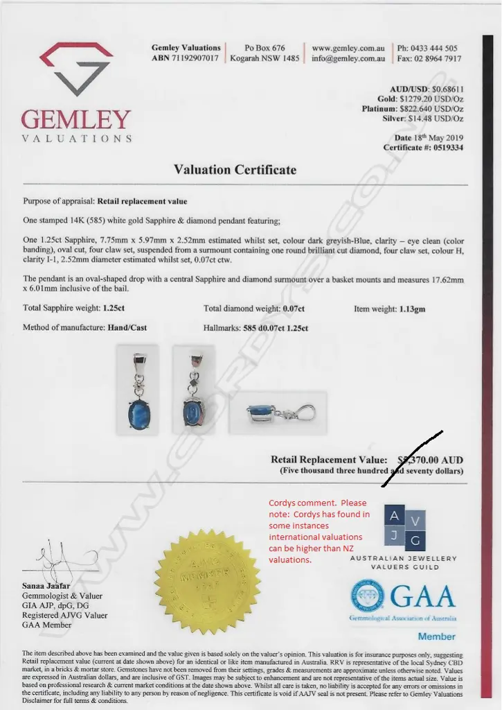 A 14ct white gold sapphire and diamond pendant Image 1++