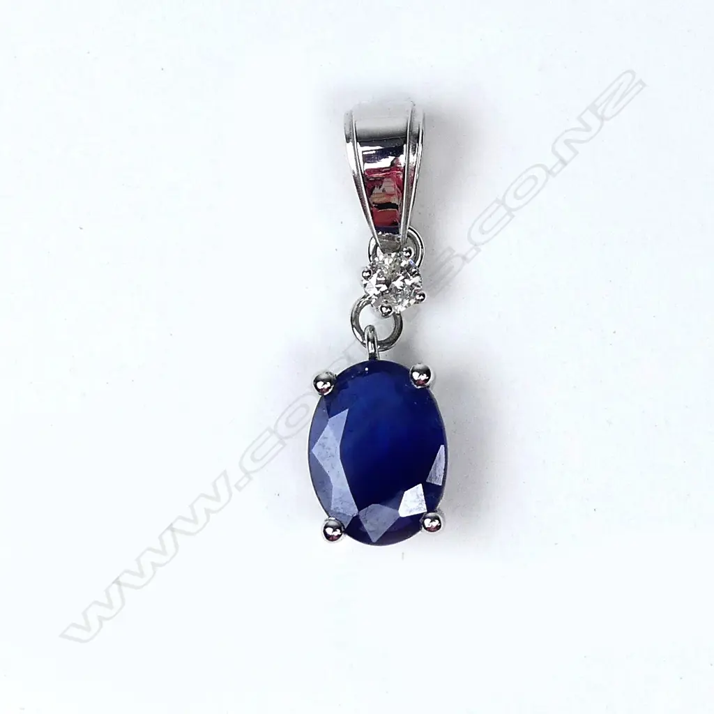 A 14ct white gold sapphire and diamond pendant Image 1++