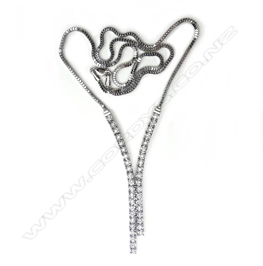 A 14ct white gold and diamond necklace Image 1++