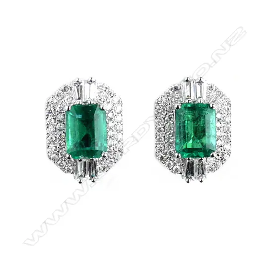 A pair of impressive 18ct white gold emerald and diamond earrings