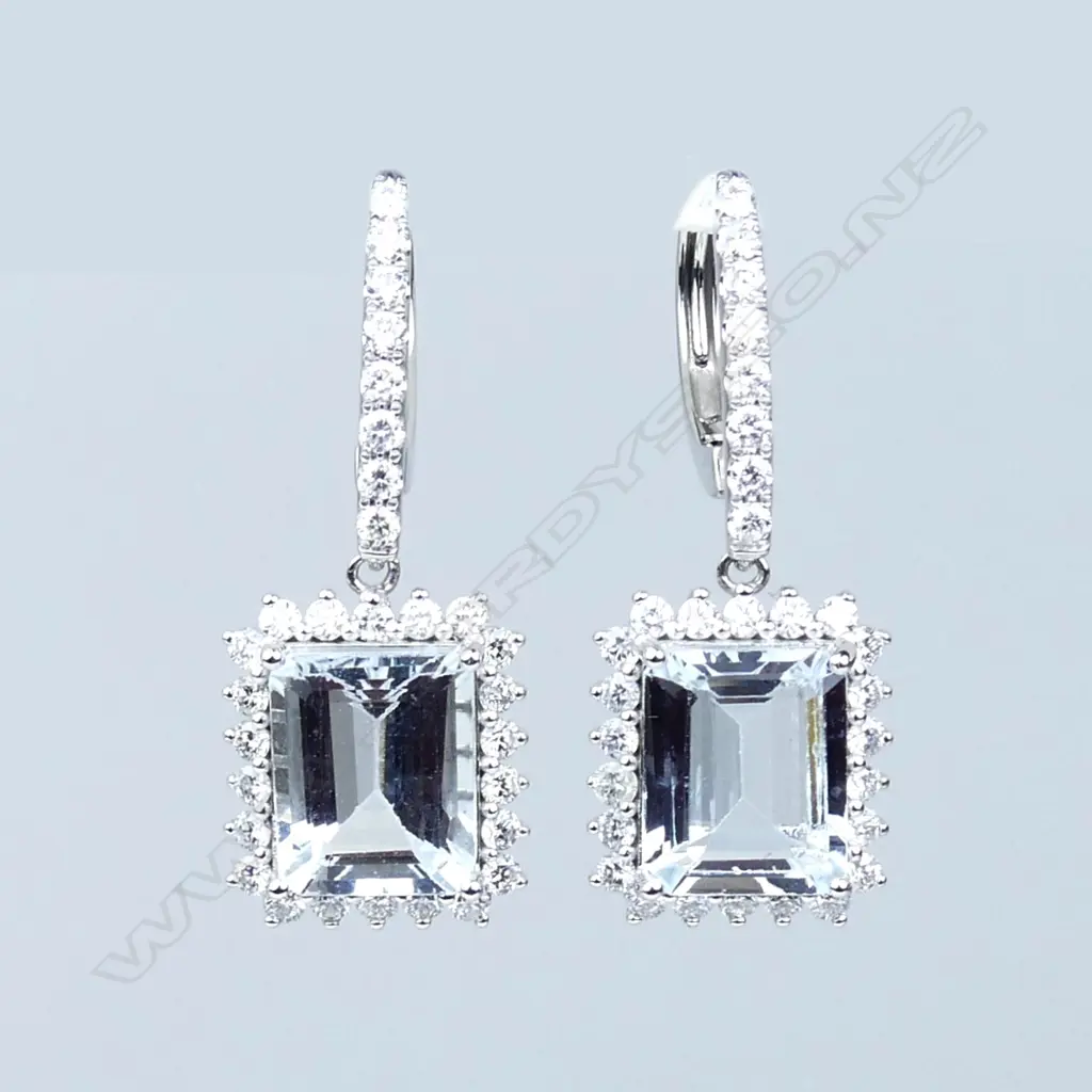 A pair of 14ct white gold aquamarine and diamond earrings Image 1++